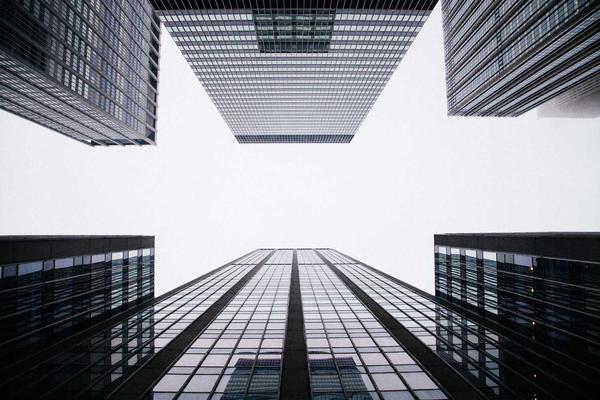 Abstract architectural glass facade reflecting light, representing transparent structural data, highly detailed, no human figures